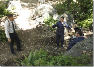BONES:  Brennan (Emily Deschanel, C), Booth (David Boreanaz, L) and Hodgins (TJ Thyne, R) investigate remains found in a paintball field in "The Memories in the Shallow Grave" season seven premiere of BONES airing Thursday, Nov. 3 (9:00-10:00 ET/PT) on FOX.  ©2011 Fox Broadcasting Co. Cr:  Beth Dubber/FOX