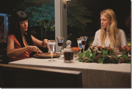 Elena (SALMA HAYEK) dines with her prisoner, O (BLAKE LIVELY), in "Savages", the ferocious thriller from three-time Oscar®-winning filmmaker Oliver Stone that features the all-star ensemble cast of Taylor Kitsch, Lively, Aaron Johnson, John Travolta, Benicio Del Toro, Hayek, Emile Hirsch and Demián Bichir.  