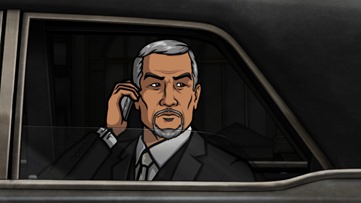 ARCHER: Episode 3, Season 5 "Archer Vice: A Debt of Honor" (airing Monday, January 27, 10:00 pm e/p). Pam makes a deal that puts everyone in danger. Archer dons his slightly darker black suit to save the day. Written by Adam Reed. Pictured: Mr. Moto (voice of George Takei). FX Network 