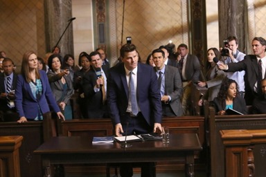 BONES:  Booth (David Boreanaz, C) is questioned by a Senate subcommittee while Brennan (Emily Deschanel, L) looks on in the "The Recluse in the Recliner" Season Finale episode of BONES airing Monday, May 19 (8:00-9:00 PM ET/PT) on FOX.  ©2014 Fox Broadcasting Co.  Cr:  Patrick McElhenney/FOX
