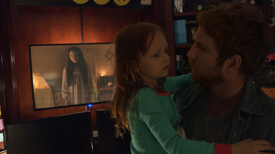 Left to right: Chloe Csengery plays Katie, Ivy George plays Leila, and Chris J. Murray plays Ryan in Paranormal Activity: The Ghost Dimension from Paramount Pictures.