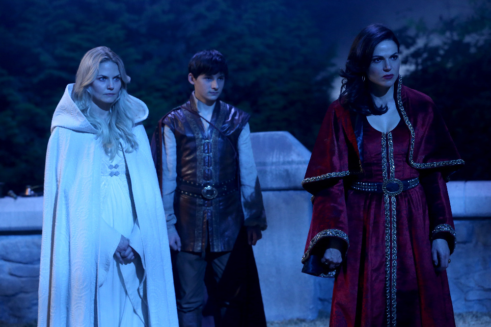 ONCE UPON A TIME - "Dreamcatcher" - In Camelot, as Mary Margaret and David attempt to retrieve the Dark One dagger, Emma uses a dreamcatcher to look into the past to see how Merlin was transformed into a tree. Together, Emma and Regina figure out the critical ingredient they must acquire to free Merlin, but it's a race against Arthur, who does not want Merlin released. Meanwhile, with encouragement from his moms, Henry musters up the courage to ask Violet on a date. Back in Storybrooke, the heroes break into Emma's house hoping to locate Gold, but what they find will give them a glimpse of Emma's end game. Far from prying eyes, Merida sets about the mission Emma has tasked her with and begins molding Gold into the hero they need to draw Excalibur, on "Once Upon a Time," SUNDAY, OCTOBER 25 (8:00-9:00 p.m., ET) on the ABC Television Network. (ABC/Jack Rowand) JENNIFER MORRISON, JARED GILMORE, LANA PARRILLA