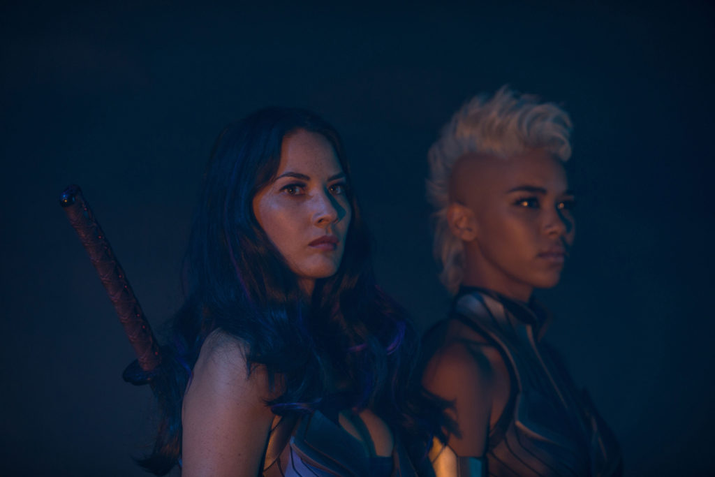 DF-13452 – Psylocke (Olivia Munn, left) and Storm (Alexandra Shipp) are two of Apocalypse’s Four Horsemen. Photo Credit: Alan Markfield.
