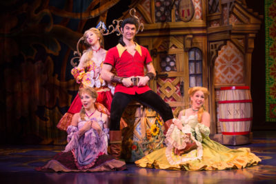 Christiaan Smith Kotlarek as Gaston and the silly girls of Disney's Beauty and the Beast. Photo by Matthew Murphy