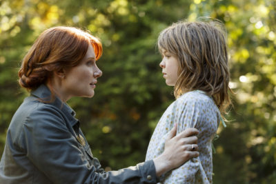 Bryce Dallas Howard is Grace and Oakes Fegley is Pete in Disney's PETE'S DRAGON, the adventure of an orphaned boy and his best friend Elliott, who just so happens to be a dragon.