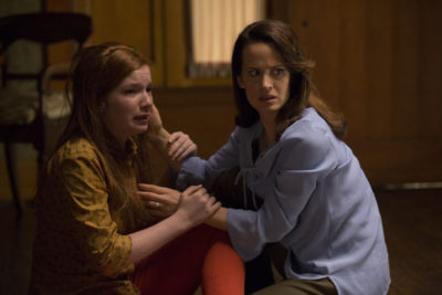 (L to R) ANNALISE BASSO as Lina and ELIZABETH REASER as Alice, her mother, in "Ouija: Origin of Evil."  Inviting audiences again into the lore of the spirit board, the supernatural thriller tells a terrifying new tale as the follow-up to 2014’s sleeper hit that opened at No. 1.  In 1965 Los Angeles, a widowed mother and her two daughters add a new stunt to bolster their séance scam business and unwittingly invite authentic evil into their home.  When the youngest daughter is overtaken by the merciless spirit, this small family confronts unthinkable fears to save her and send her possessor back to the other side.