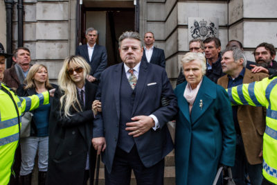 National Treasure- Paul Finchley (Robbie Coltrane) is a bona fide "national treasure", one half of a popular, long-running comedy double act. However, the famous comedian's world is thrown into chaos when he is accused of historic sexual abuse.  Pictured:   Andrea Riseborough as Dee, Robbie Coltrane as Paul Finchley, Julie Walters as Marie Finchley. (Photo by: Hulu)